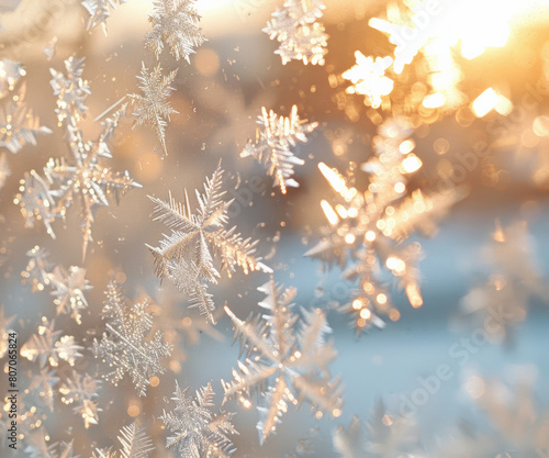 Frost snowflake on the mirror window panes create a essence of Chrismas and Winter mood and tone at soft beige hues in the morning light. © Surachetsh