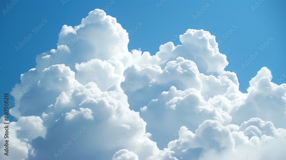 Naklejka premium Puffy white clouds against a bright blue sky, capturing the soft, airy texture visually.