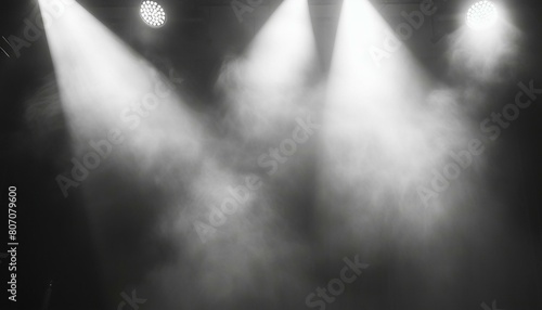 Dynamic Stage Atmosphere  Stage Lights and Smoke Engulf the Scene  Spotlights and White Laser Holograms Spin  Emitting Bright Beams in a Striking Black and White Display.   