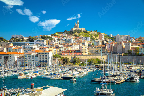 City of Marseille harbor and Notre Dame de la Garde church on the hill view photo