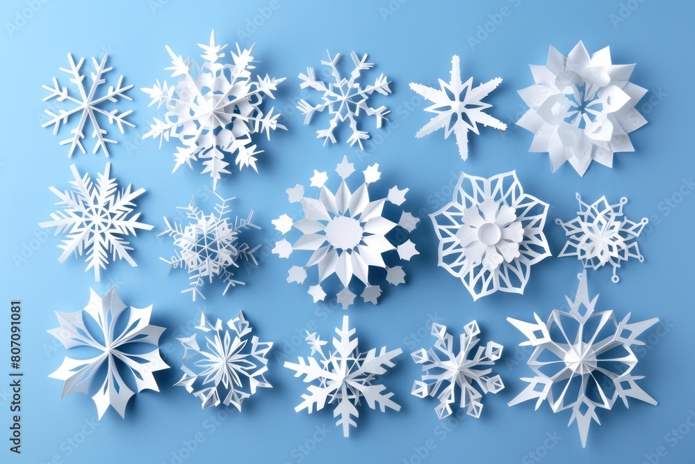 A collection of paper snowflakes in different shapes and sizes. A collection of paper snowflakes in different shapes and sizes.