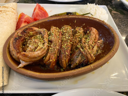 Kokorec Turkish Traditional Offal Food in Casserole served at Local Restaurant.
