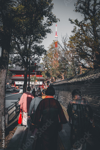 Japanese women walking towards tokyo tower traditional dress