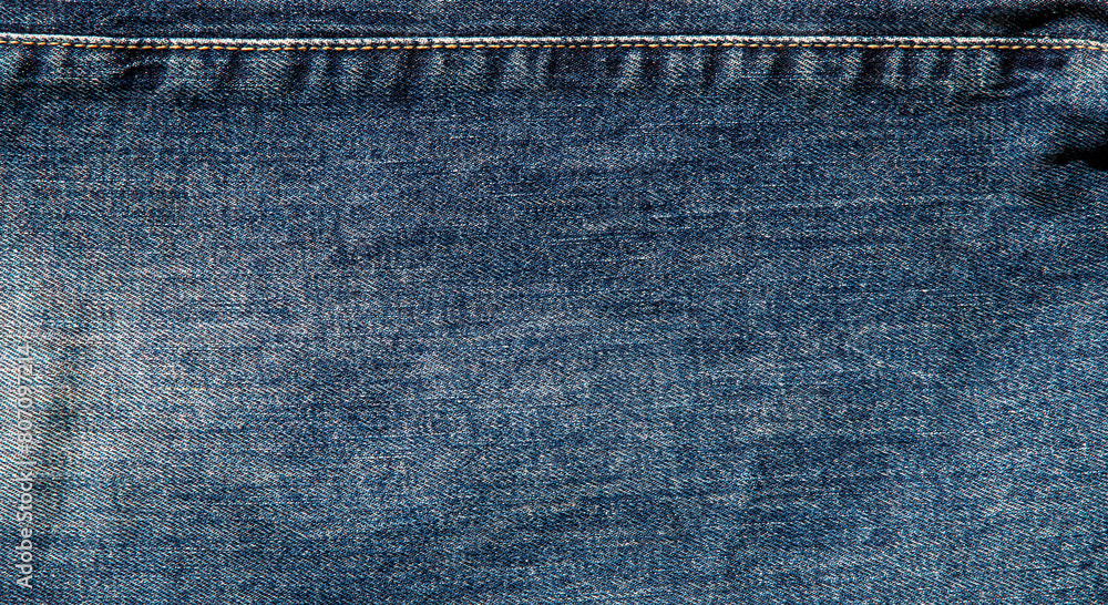 texture of blue jeans denim fabric with seam background texture of blue jeans denim fabric with seam background