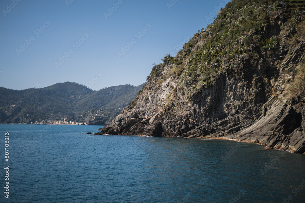 Mediterranean coast of sunny Italy - picturesque coast with rocks and boats - tourist route