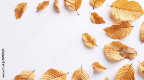  A pile of yellow leaves stacked on a white surface next to one another