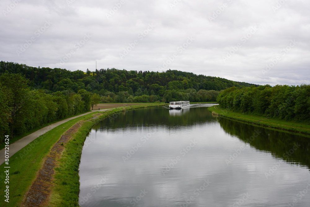 Fototapeta premium Excursion boat on the Danube river near Bad Abbach, Bavaria, Germany.