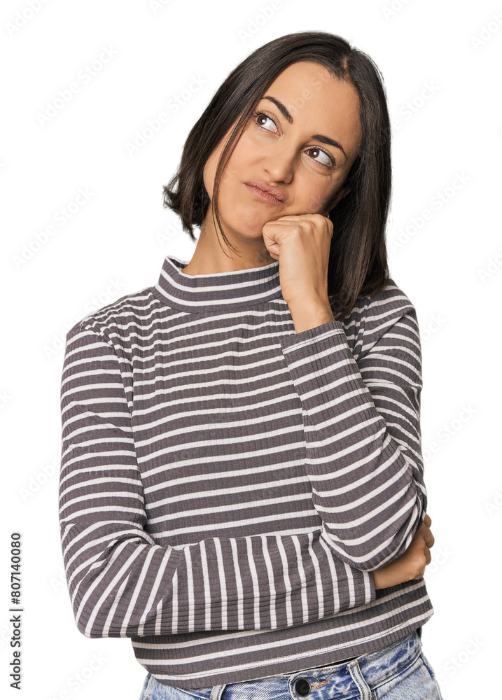Young Caucasian woman with short hair thinking and looking up, being reflective, contemplating, having a fantasy. Young Caucasian woman with short hair thinking and looking up, being reflective, contemplating, having a fantasy.