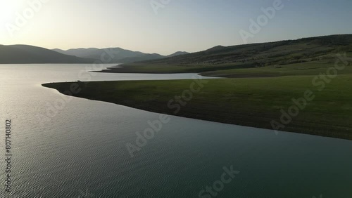 Wallpaper Mural line of the shore of a mountain lake at sunset, green slope shore, aerial view Torontodigital.ca