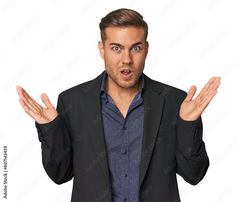 Businessman in suit, studio shot surprised and shocked. Businessman in suit, studio shot surprised and shocked.