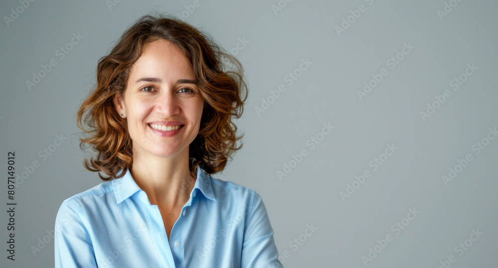 Fototapeta premium Photo of Smiling businesswoman in blue shirt 
