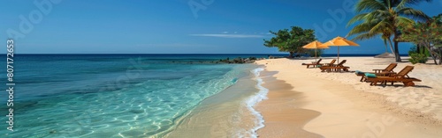 Sandy beach with rows of chairs and umbrellas set up for relaxation under the sun