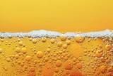 Beer with foam and bubbles on yellow background,  Close-up