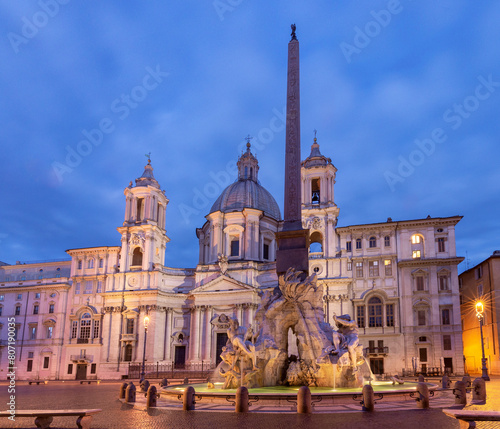 The famous fountains with tritons in Piazza Navona in Rome at dawn.