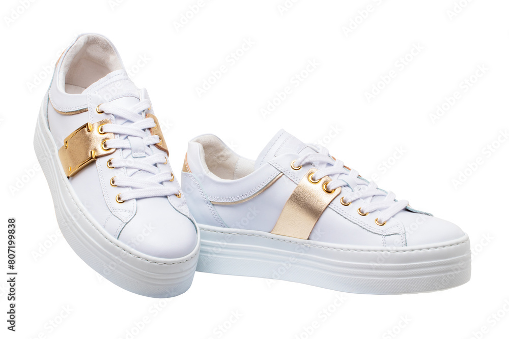 White sneaker isolated. Close-up of a pair white elegant stylish female leather high-heeled sport shoes isolated. Clipping path. Womens shoe fashion. Modern design footwear for workout. White sneaker isolated. Close-up of a pair white elegant stylish female leather high-heeled sport shoes isolated. Clipping path. Womens shoe fashion. Modern design footwear for workout.