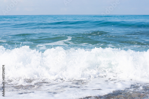 Natural background with oceanside sea waves with ащфь.Shore with copy space,tourism,vacation
