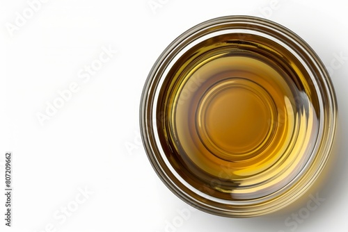 Cooking oil in glass bowl top view white background