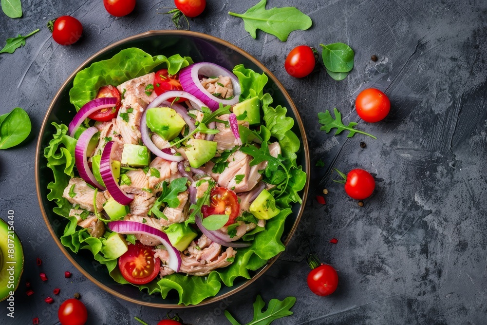 French style tuna salad with lettuce cherry tomatoes avocado and red onions Healthy dish From above with empty space French style tuna salad with lettuce cherry tomatoes avocado and red onions Healthy dish From above with empty space