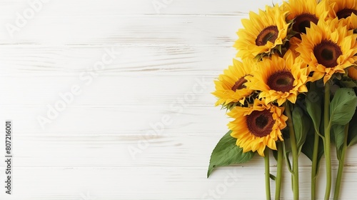 Sunflowers on white wooden background