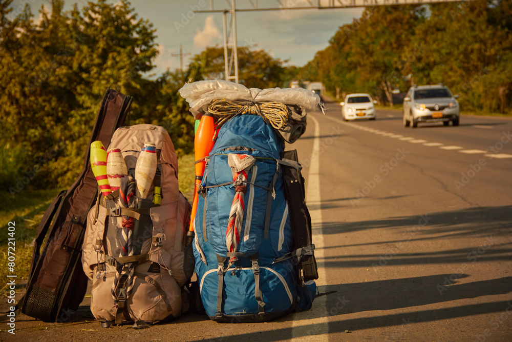 Travel backpacks in the road