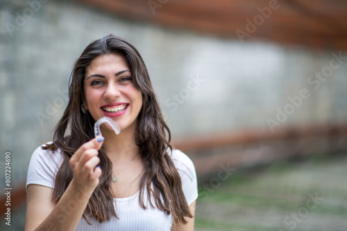 Beautiful Smiling Turkish Woman with invisible teeth bracket aligner