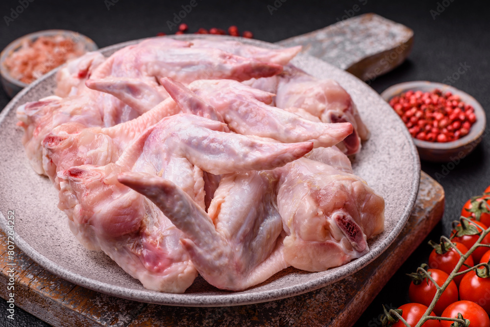 Fresh chicken wings with salt, spices and herbs