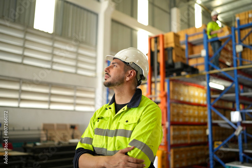 Warehouse worker working in warehouse storage. Foreman or worker work at factory site check up products in site. Inventory worker working in factory Storehouse.