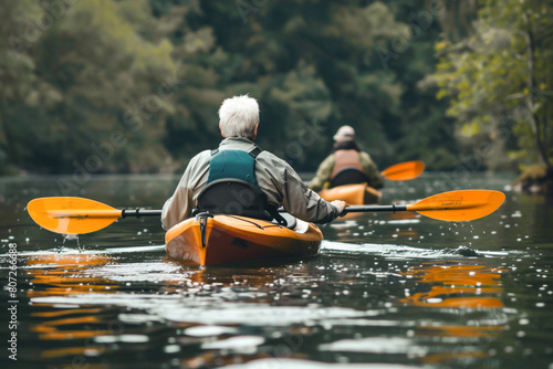 Backview of elderly man and woman kayaking on the water in nature, active retirement lifestyle concept, Generative AI #807266688