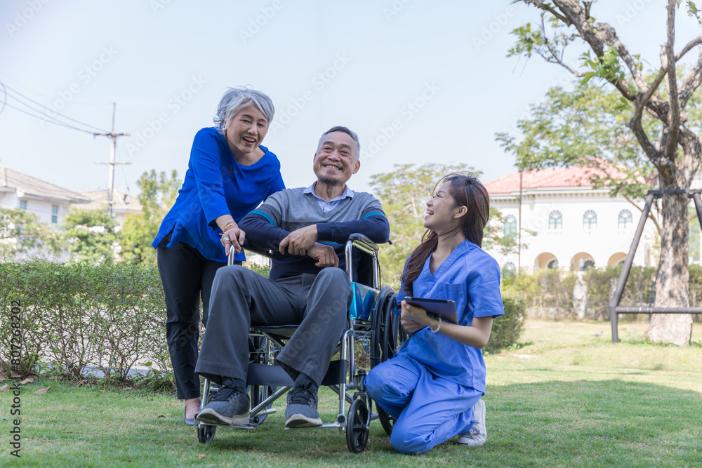 Doctor or Caregiver nurse take care a Senior patient sit on wheelchair. Doctor or Nurse helping senior Man Doctor or Caregiver nurse take care a Senior patient sit on wheelchair. Doctor or Nurse helping senior Man