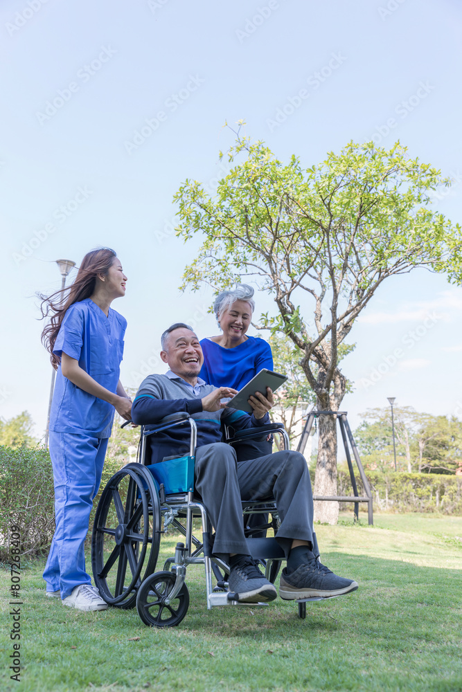 Doctor or Caregiver nurse take care a Senior patient sit on wheelchair. Doctor or Nurse helping senior Man Doctor or Caregiver nurse take care a Senior patient sit on wheelchair. Doctor or Nurse helping senior Man
