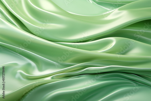 Luxurious green silk or satin fabric background with soft waves