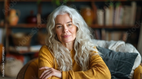 Woman Sitting on Top of Couch by Window