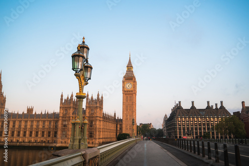 The Big Ben and Houses of Parliament against blue sky at sunrise. London, UK