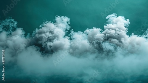   A striking image captures a vast cloud of smoke rising majestically into the sky, bathed in shades of green and teal Taken from a vantage point on the ground photo