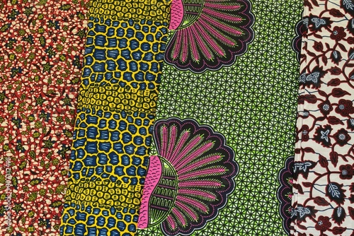 Close up of red blue yellow and green multi colour patterned African Ghanaian traditional cotton print cloths photo
