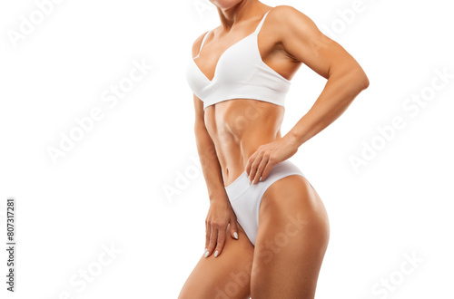 A slender swarthy woman in a white underwear on a white background. Healthy lifestyle, sport and diet.