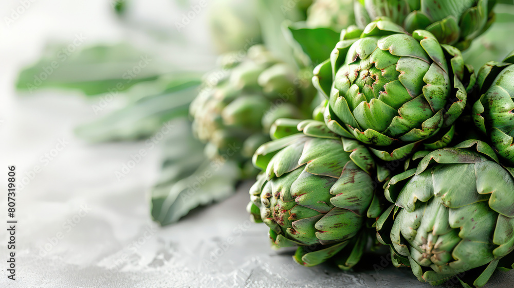 A cluster of fresh green flowers resting on top of a table A cluster of fresh green flowers resting on top of a table