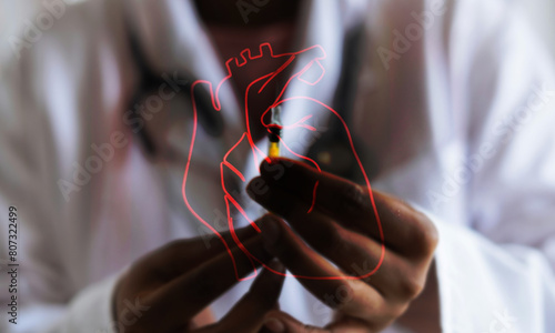 Doctor and drawn heart, Doctor preparing syringe with outline of biological heart over the top