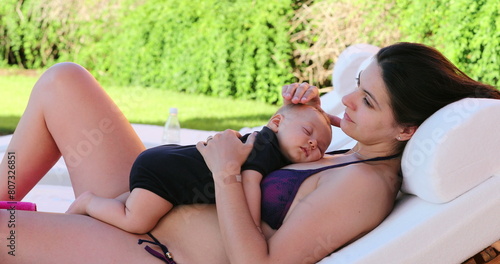 Mother and baby infant together by the swimming pool 4 month old baby taking nap with mom © Marco