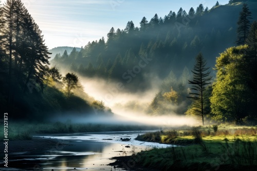 Misty mountain river landscape at sunrise