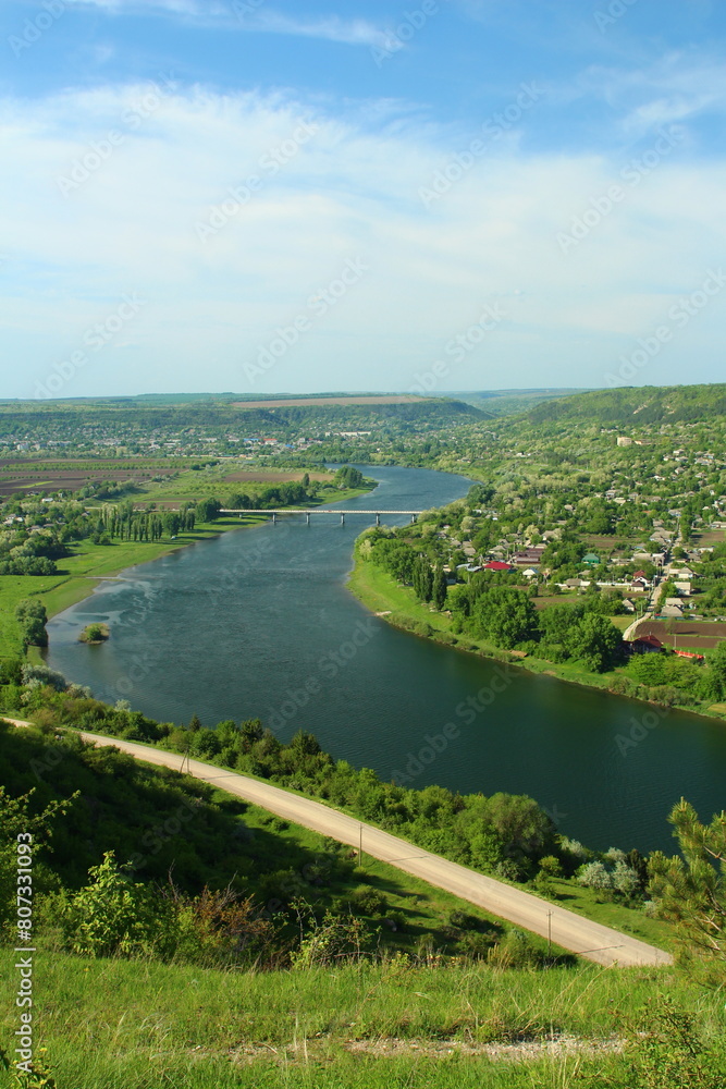 A river with a town in the distance A river with a town in the distance