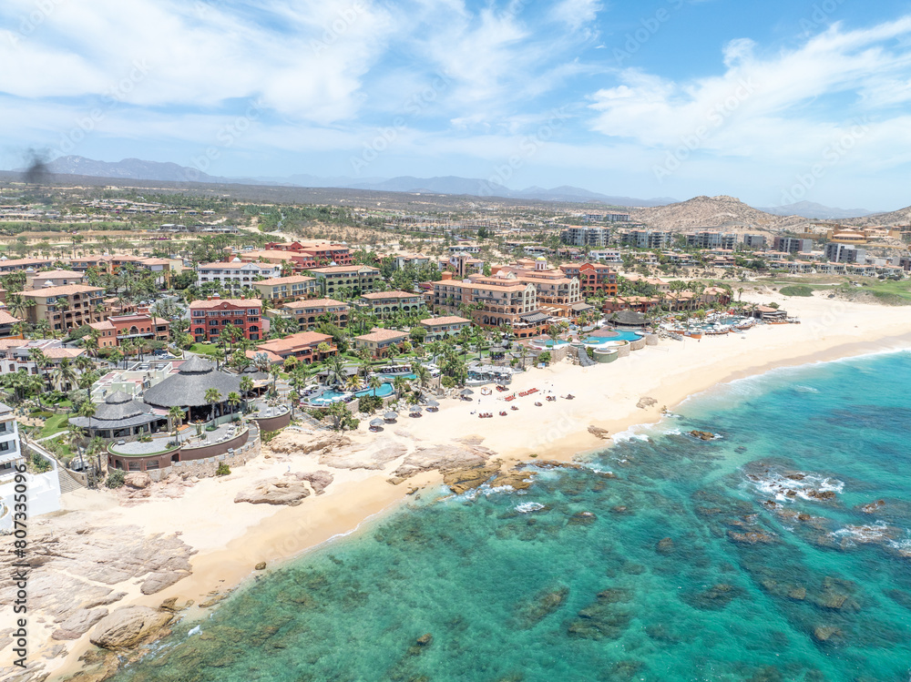 Fototapeta premium Aerial view of tropical beach with resorts in Cabo San Jose, Baja California Sur, Mexico