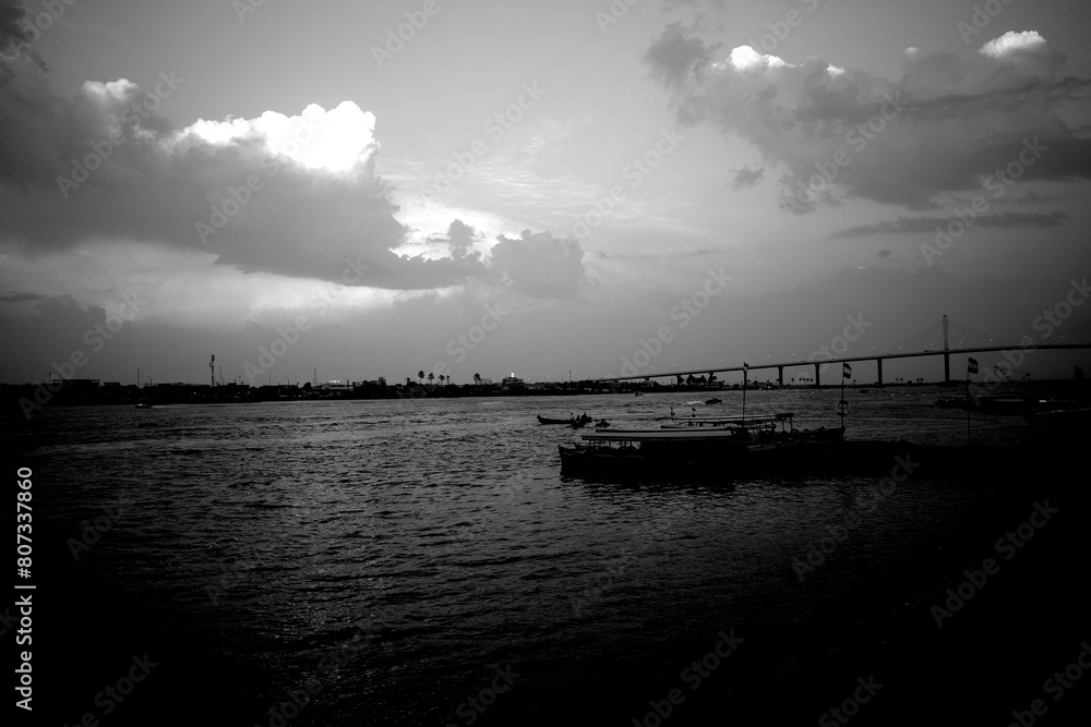 Basrah, Iraq- April 28, 2024: photo of boats in the river side in basra city during cloudy weather Basrah, Iraq- April 28, 2024: photo of boats in the river side in basra city during cloudy weather