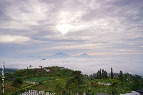 a beauty landscape clouds over the mountains and ricefields in java indonesia photo