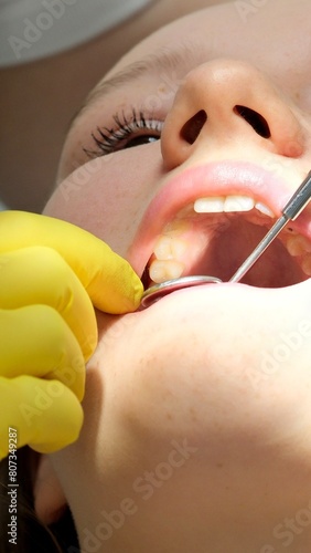 Dentist curing a female patient . High quality photo