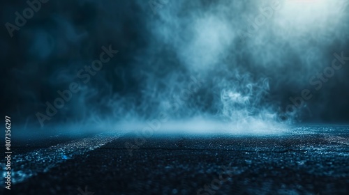 An abstract night background with smoke on the asphalt floor under soft blue light. Dark scene of an empty space for product presentation.