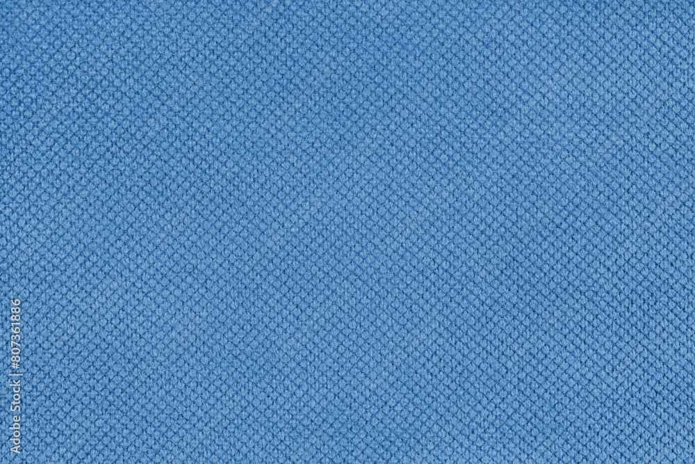 Plain blue velor upholstery fabric, jacquard with fine diamond texture background. Close up, macro cloth textile surface. Wallpaper, backdrop with copy space Plain blue velor upholstery fabric, jacquard with fine diamond texture background. Close up, macro cloth textile surface. Wallpaper, backdrop with copy space