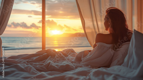 Linda mulher deitada em uma cama na praia olhando a paisagem ao por do sol - wallpaper HD photo