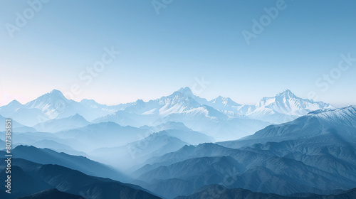 Majestic Snow-Capped Mountain Range under Clear Blue Sky