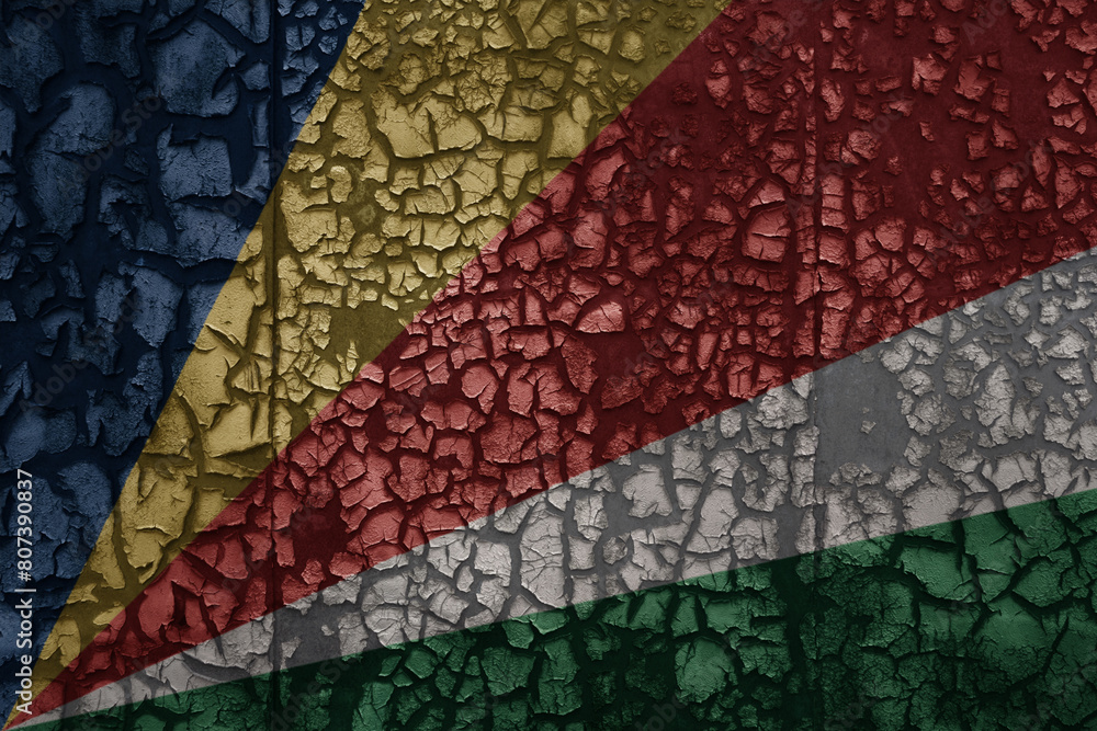 flag of seychelles on a old grunge metal rusty cracked wall background flag of seychelles on a old grunge metal rusty cracked wall background